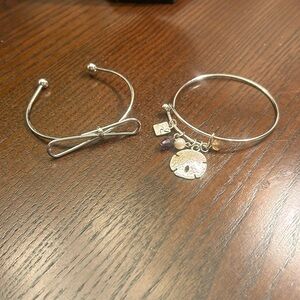 Silver-tone bracelets, 1 with bow and 1 with beach theme